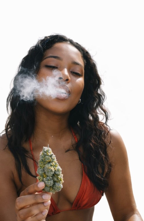 Woman smoking Blue dream cannabis against a white background