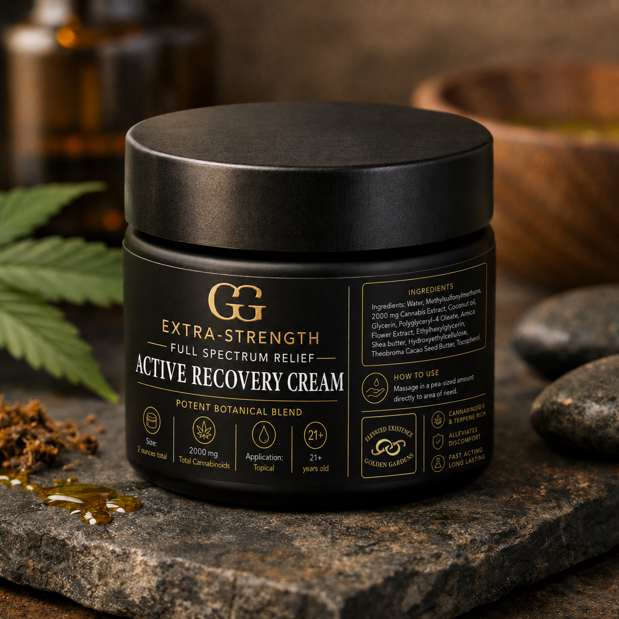 Black jar of GG Extra-Strength Active Recovery topical on a stone surface with cannabis leaves and bottles in the background.