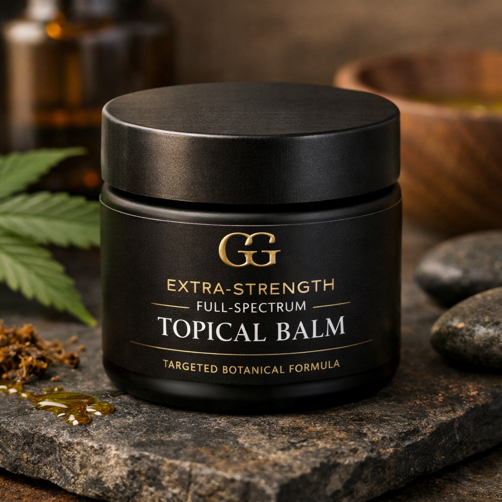 Black jar of GG Extra-Strength Full-Spectrum Topical Balm pain and inflammation on a stone surface with cannabis leaves and stones in the background.