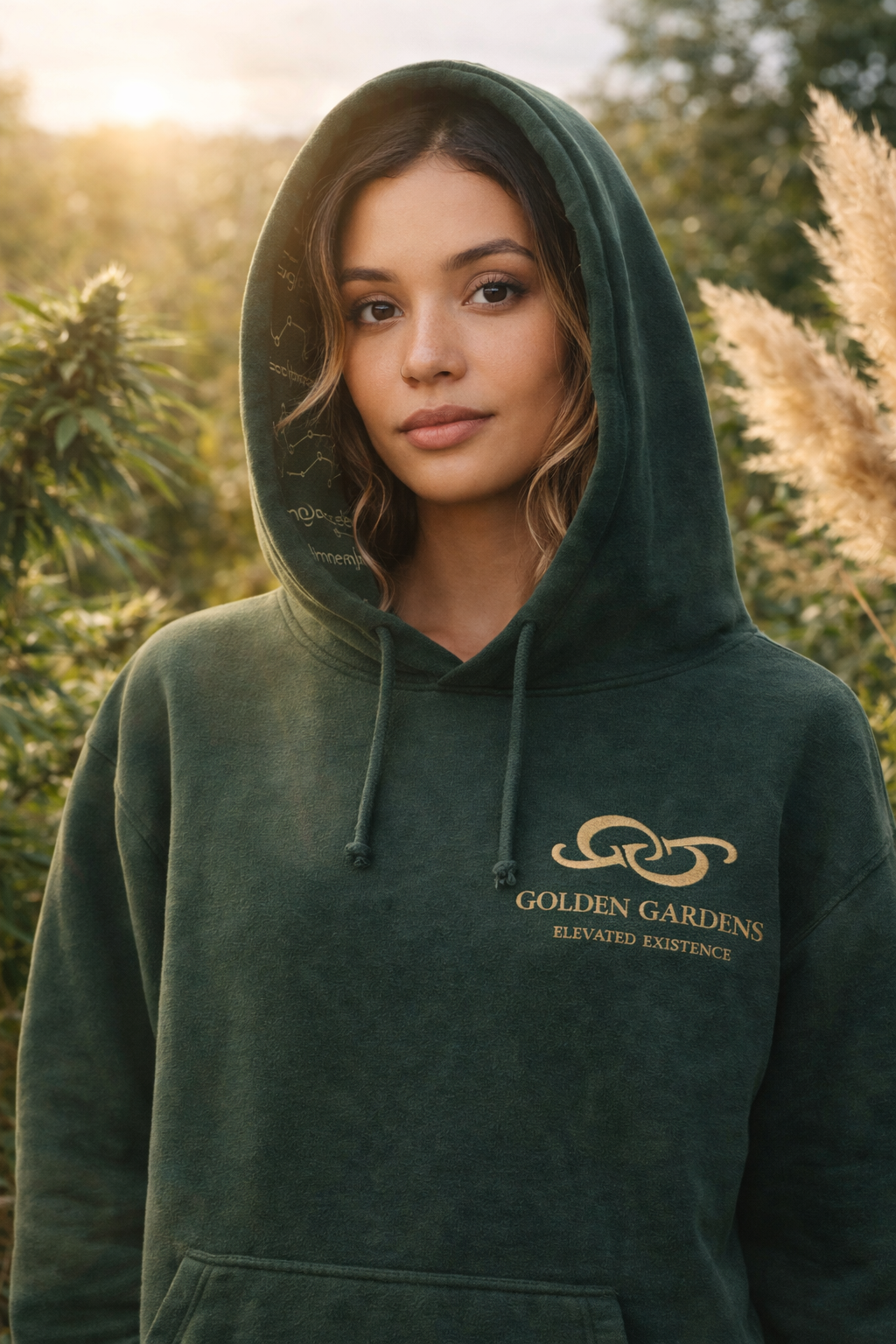 Person wearing a green hoodie with 'Golden Gardens' logo in an outdoor setting