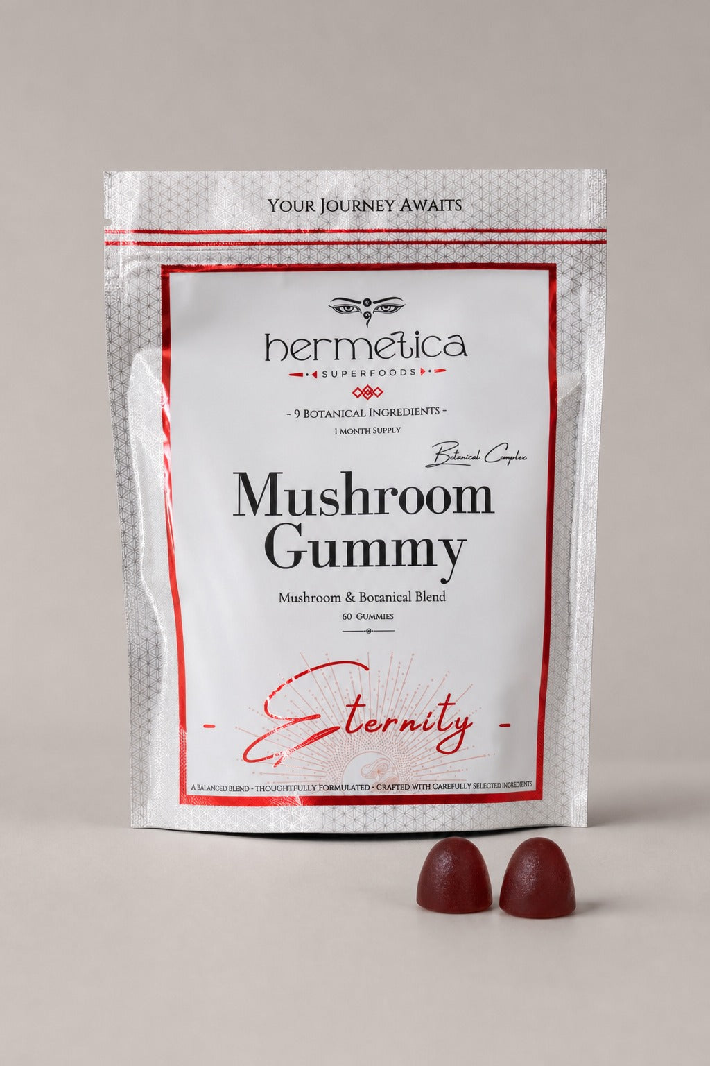 Hermetica Eternity Mushroom Complex Gummy 60-count pouch with two dark burgundy gummies